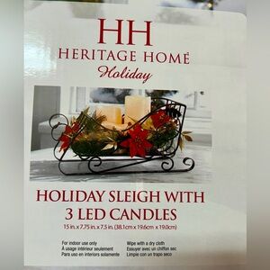 Holiday sleigh and candle decor